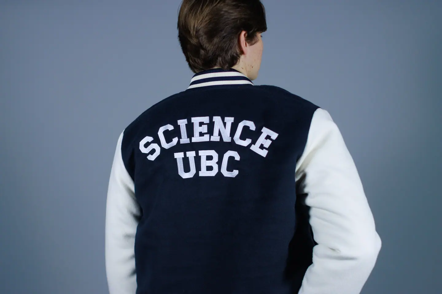 The back of a navy and white varsity jacket lettered Science UBC